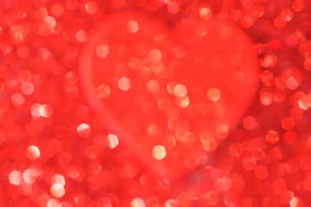Heart on defocused red glitter