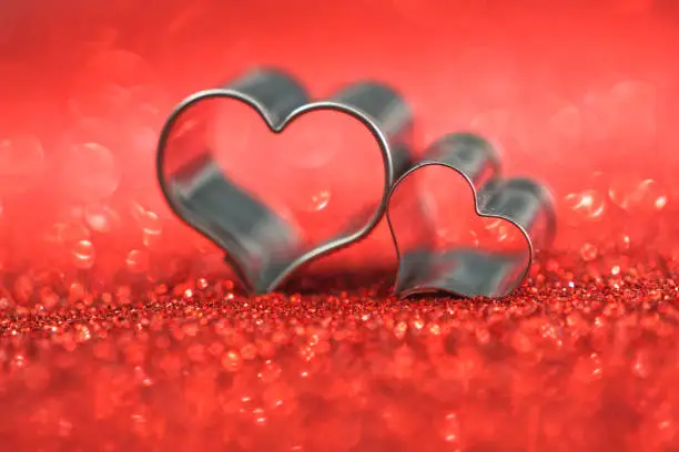 Hearts on defocused red glitter