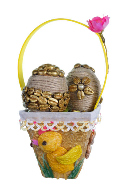 istock Easter handmade eggs from golden coffee beans and vegetables seeds in pasta basket. Isolated 1132225663