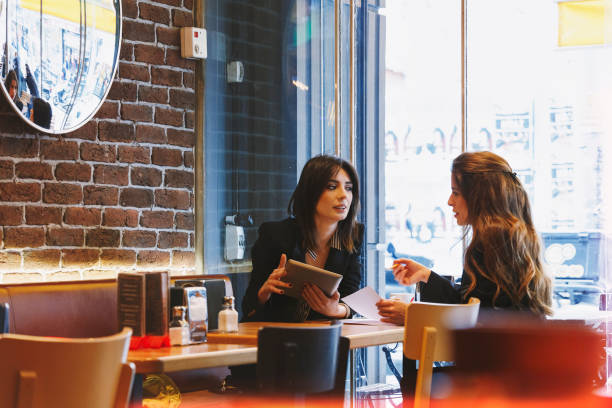 istock Modern business people working at a cafe 1132225948
