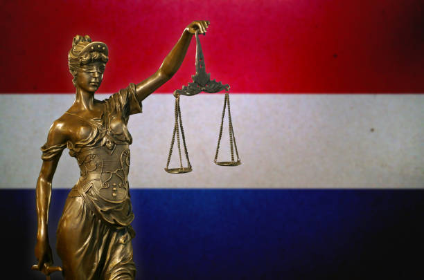 istock Lady Justice before a Dutch flag 1132227506