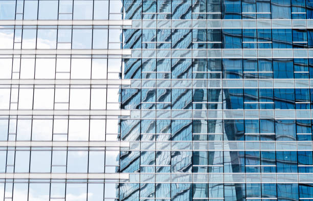 istock Cloudy sky reflected in windows of modern building 1132229294