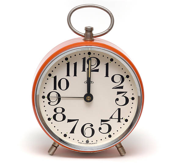 istock retro alarm clock isolated 12 o'clock 113222970