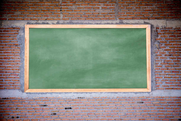 istock Empty green chalkboard texture hang on the brick wall. double frame from greenboard and white background. image for background, 1132230653