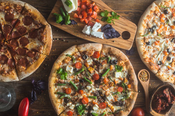 istock Pizza with cheese, pepperoni, chicken and pepper, a slice for a gourmet dinner 1132230715