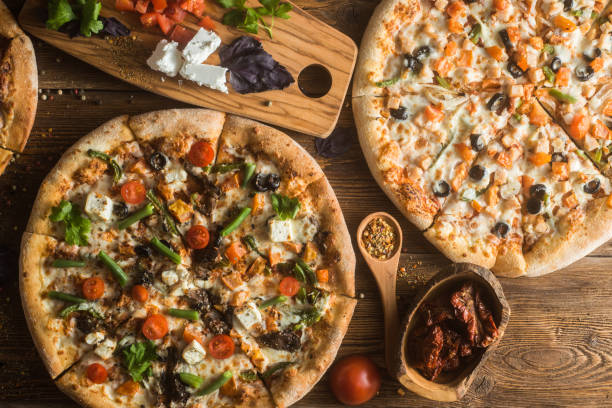 istock Pizza with cheese, pepperoni, chicken and pepper, a slice for a gourmet dinner 1132230716