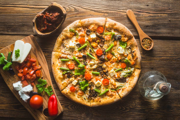 istock Pizza with cheese, pepperoni, chicken and pepper, a slice for a gourmet dinner 1132230717