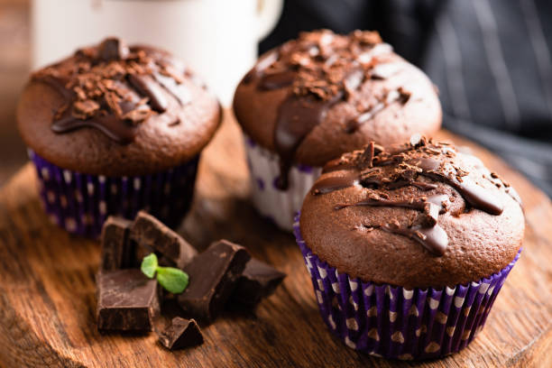 istock Tasty chocolate muffins decorated with chocolate sauce 1132230906