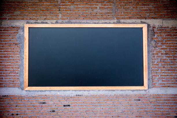 istock Empty green chalkboard texture hang on the brick wall. double frame from greenboard and white background. image for background, 1132231265