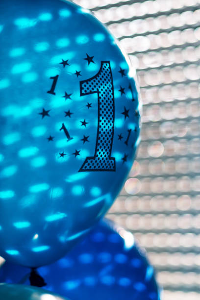 istock Blue birthday balloons with number one 1132232036