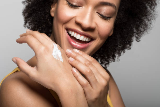 istock Girl applying moisturizer on her hands 1132237315
