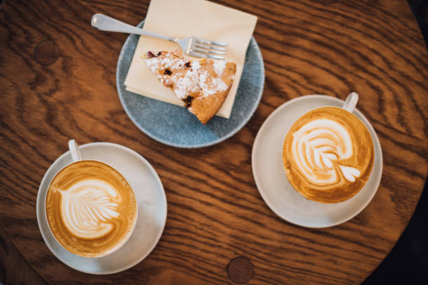 istock Two cups of coffee and cake 1132237909