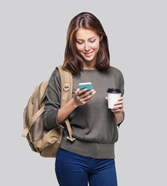 istock Happy young student girl using smart phone 1132238721