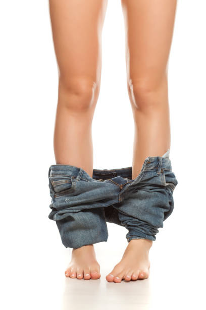 istock woman with her pants down on white background 1132240117