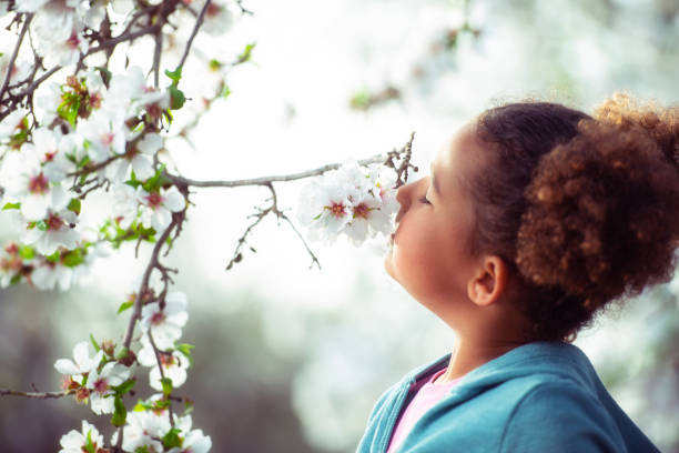 istock Girl enjoying blooming aroma. 1132240511
