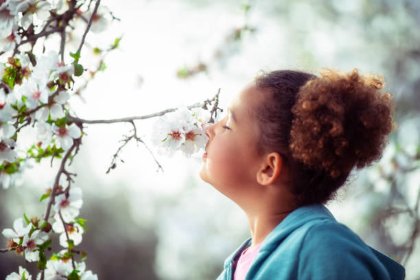 istock Girl Enjoying blooming aroma. 1132244178