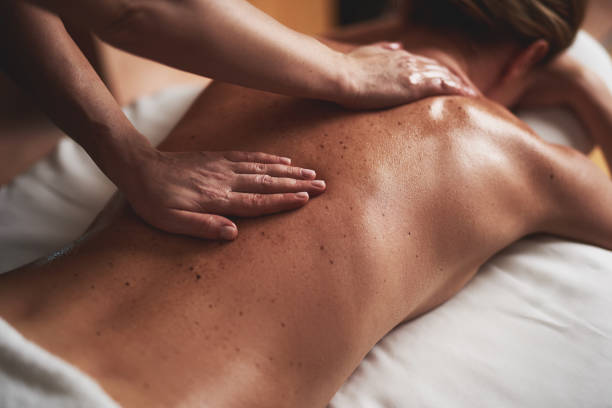 istock Young lady having massage of back in spa salon 1132244369