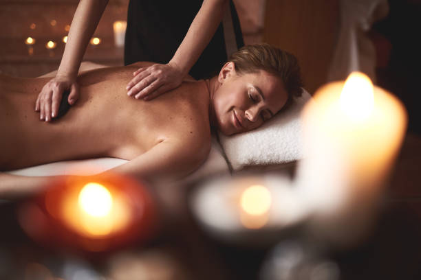 istock Young lady have relaxing massage with warm stones 1132244402
