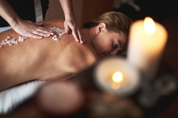 istock Therapist make massage with mineral salt to lady 1132244430
