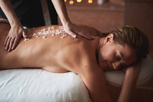 istock Therapist make healthy massage with mineral salt 1132244434