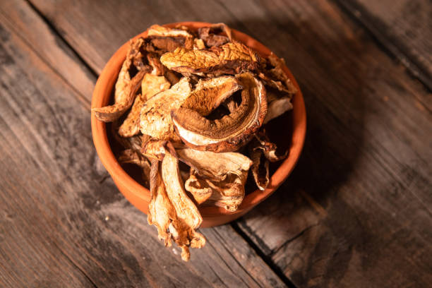 istock Dried wild boletus mushrooms in vintage ceramic bowl 1132246593