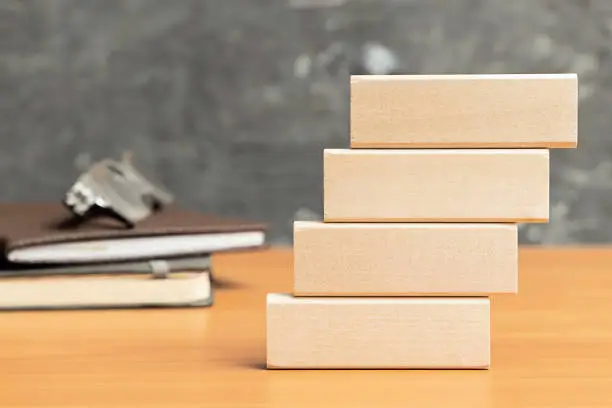 Wooden cubes stand in a row. Development of business and growth of investments
