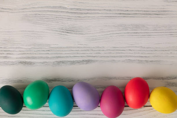 istock Top view of colorful easter eggs on white table 1132246974