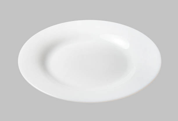 istock White dessert plate. Light gray isolated background. View from above. 1132248029