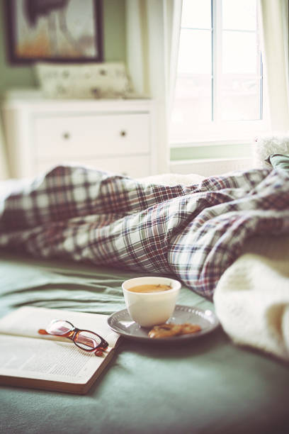 istock Crumpled bedding with tea and book for a relaxing day 1132248255