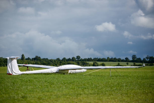 istock Gliders parked on the ground in front of rain clouds 1132248535