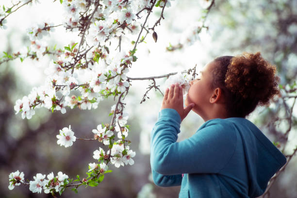 istock Girl Enjoying blooming aroma. 1132248654