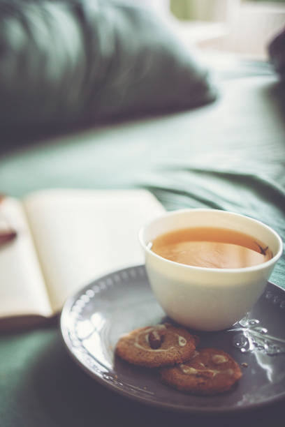 istock Crumpled bedding with tea and book for a relaxing day 1132248881