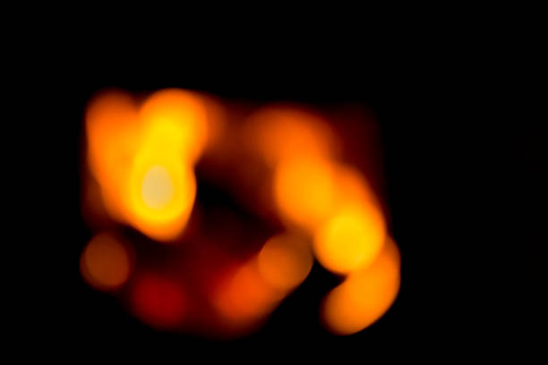 istock Blurred background with burning firewood in the fireplace. 1132251330