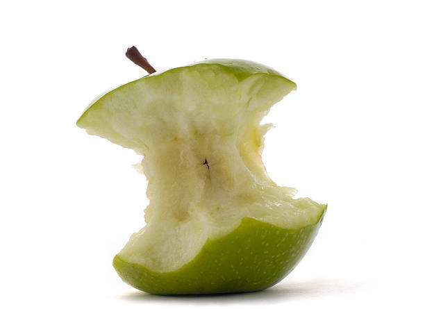 istock apple green half eaten, isolated white background 113225257