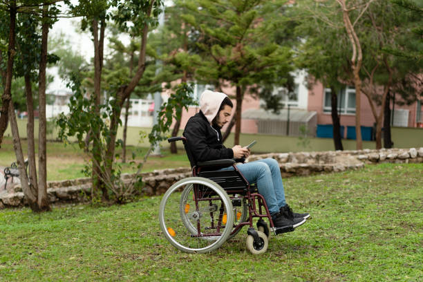 Disabled Raver 170+ Disabled Man Using Tablet In A Park Stock Photos, Pictures ...