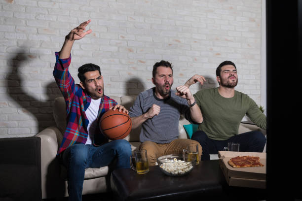 istock Disappointed Basketball Fans Watching TV 1132255910