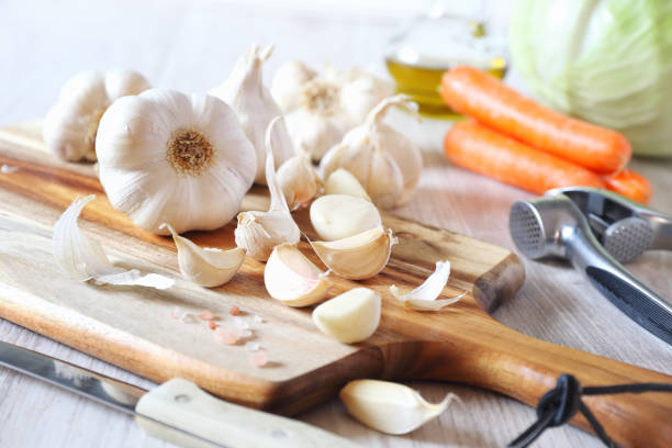 istock Bulbs of garlic, carrots and cabbage 1132256236