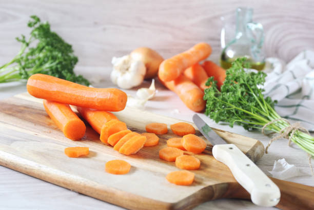raw food ingredients.  peeled chopped carrots - 3148 imagens e fotografias de stock