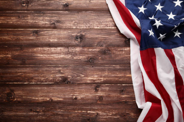 istock American flag on brown wooden table 1132257946