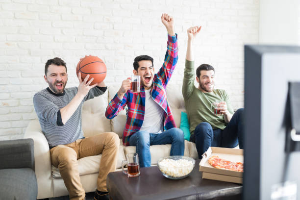 istock Guys Hanging Out And Watching Basketball Match 1132257978