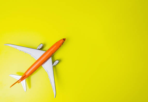 istock Toy model plane on yellow background. Travel, trip concept. Image with copy-space. 1132259317
