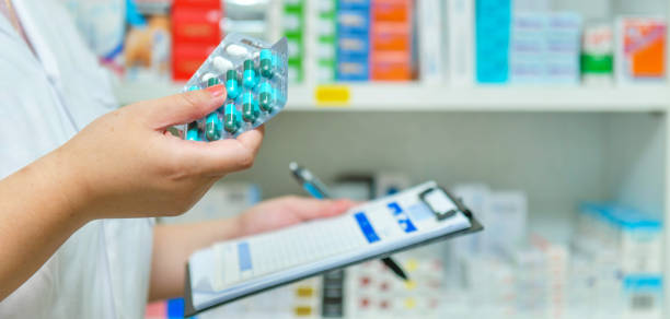 istock Pharmacist filling prescription in pharmacy 1132261468