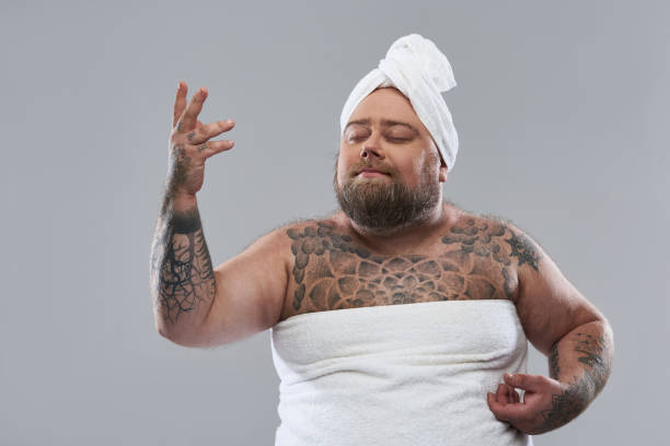 istock Funny bearded man putting his hand up and looking dreamy 1132261599