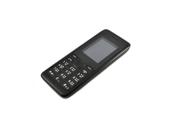 istock Black telephone / Old model mobile phone isolated on white background 1132261694
