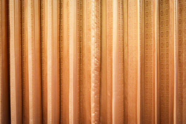 istock Golden orange fabric curtain texture background 1132261723