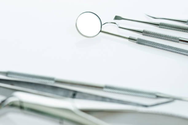 istock Dentist medical tools on white background 1132262323
