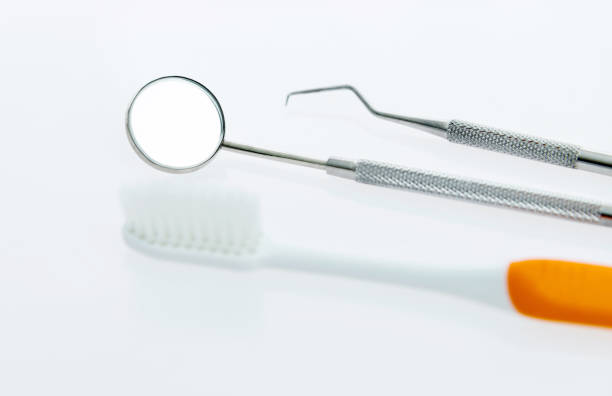 istock Dentist medical tools and toothbrush on white background 1132262751