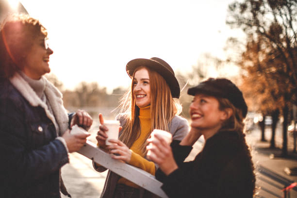 istock Smilling girls having coffee break 1132263545