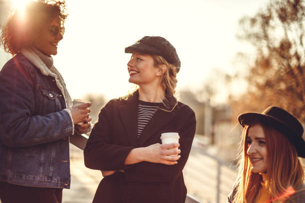 istock Smilling girls having coffee break 1132263773
