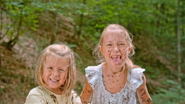 istock Girls playing in mud 1132263933